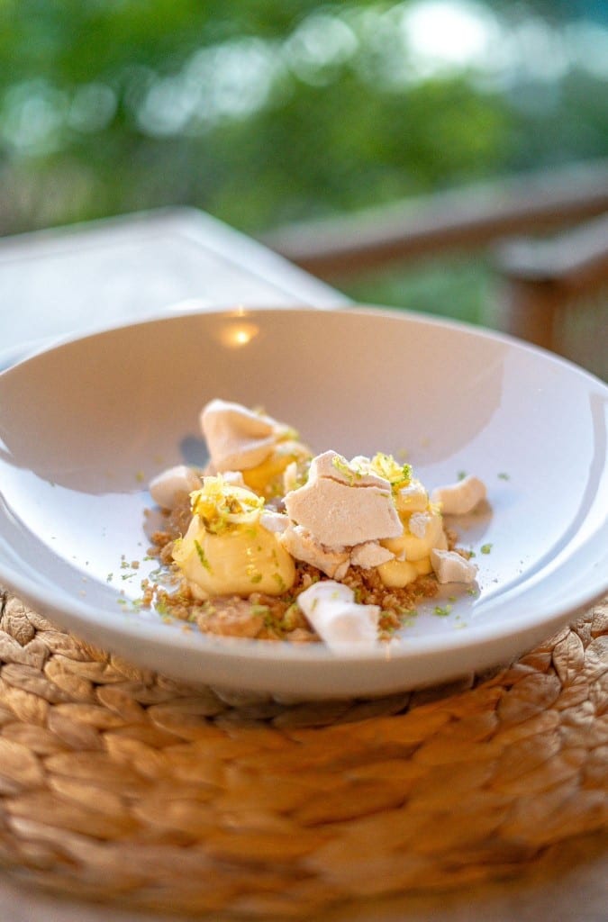 Deconstructed lemon dessert with meringue and citrus zest on the terrace